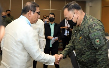 <p><strong>PARTNERSHIP.</strong> Maj. Gen. Adonis R. Bajao, Army Vice Commander (right), shakes hands with Department of Science and Technology (DOST) Sec. Renato Solidum (left) during the signing ceremony for the Philippine Army-DOST's Project COBRA (Controller-Operated Battle Ready Armament) at the World Trade Center, Pasay City on Wednesday (Nov. 23, 2022). The Project COBRA demonstrates DOST’s commitment to helping soldiers effectively fulfill their mandate to serve the people and secure the land and bolster the Army’s Self-Reliant Defense Program. <em>(Photo courtesy of Philippine Army)</em></p>