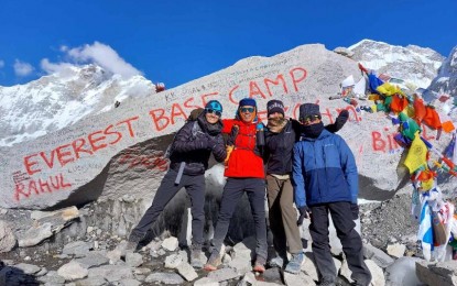 <p><strong>CHAMP.</strong> Army Staff Sgt. Andrico Mahilum (right) poses with his coach Thumbie Remigio (2nd from left) and co-athlete Corporal Ailene Tolentino (2nd from right) during the Altitude Obstacle Course Races World Championships held at the Mount Everest Base Camp in Nepal on Nov. 22, 2022. Mahilum won the competition while Tolentino finished third in the women's category, the Philippine Army said Friday (Nov. 25, 2022). <em>(Photo courtesy of the Philippine Army)</em></p>