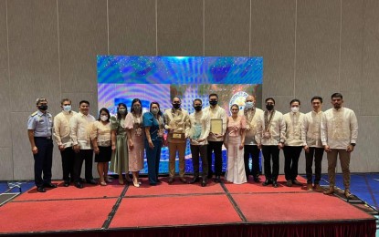 <p><strong>AWARD</strong>. A contingent from the municipality of Caluya receives their prize as the grand winner in the "Malinis at Masaganang Karagatan" of the Bureau of Fisheries and Aquatic Resources (BFAR) during the awarding ceremony at the Luxent Hotel in Quezon City on Nov. 22, 2022. BFAR-Antique head Richard Cordero said on Friday (Nov. 25, 2022) that the municipality's strength in winning the award is its solid waste management program.<em> (Photo courtesy of BFAR-Antique)</em></p>