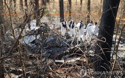 <p><strong>HELICOPTER CRASH</strong> First responders search for survivors after a helicopter crashed into a hill in Yangyang, Gangwon Province, on Sunday, (Nov. 27, 2022). Five people died in the incident. <em>(Yonhap)</em></p>