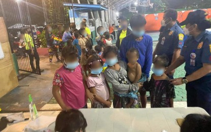 <p><strong>RESCUED.</strong> The Quezon City government’s Task Force Sampaguita rescues 377 mendicants, including 167 children, during a city-wide operation on Thursday (Nov. 24, 2022). After a security check by the police, they underwent medical assessments and Covid-19 tests, were interviewed by social workers and profiled by the public employment services. <em>(Courtesy of QC Government Facebook)</em></p>