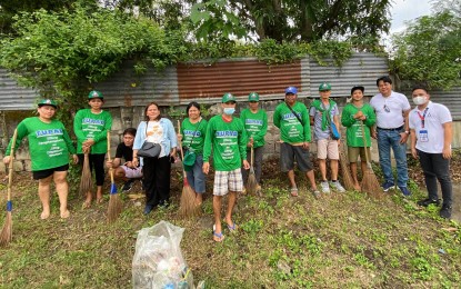 <p><strong>COMMUNITY CLEAN-UP.</strong> Personnel of the Department of Labor and Employment (DOLE) in Pampanga monitor beneficiaries of the "Tulong Panghanapbuhay para sa Ating Disadvantaged at Displaced Workers" (TUPAD) program from the towns of Lubao and Magalang during their community clean-up and clearing operations in this undated photo. More than 2,000 residents in Pampanga have so far benefited from the program in November. <em>(Photo courtesy of DOLE-Pampanga)</em></p>