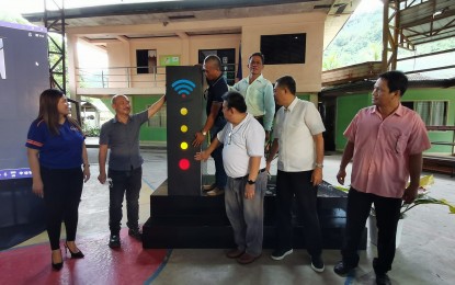 <p><strong>SWITCH-ON</strong>. Officials of the Department of Information and Communications Technology, Energy Development Corporation, Negros Oriental Chamber of Commerce and Industry and local officials lead the official switch-on of the free Wi-Fi project in Barangay Caidiocan, Valencia, Negros Oriental. This is the 3rd E-community free Wi-Fi project to be launched in the country. <em>(PNA photo by Judy Flores Partlow)</em></p>