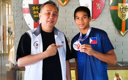<p><strong>COURTESY CALL.</strong> Philippine Olympic Committee president Abraham 'Bambol" Tolentino (left) welcomes boxer Ronel Suyom at the Knights Templar Rdge Hotel in Tagaytay City on Tuesday (Nov. 29, 2022). Tolentino said Suyom is a potential “next big thing” of Philippine boxing. <em>(Contributed photo)</em></p>