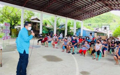 <p><strong>SHELTER NEEDS</strong>. Tacloban City housing office chief Ted Jopson (left) speaks to housing project beneficiaries in the northern part of Tacloban City in this March 8, 2022 photo. The national government will finance the construction of 10,000 medium-rise housing units to address the city’s growing housing needs.<em> (Photo courtesy of Tacloban city housing office)</em></p>