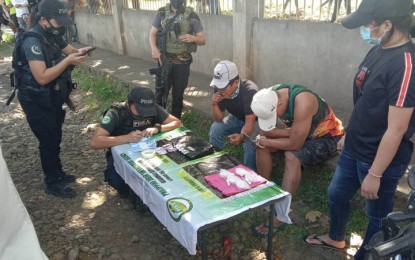 <p><strong>DRUG BUST.</strong> Government operatives arrest two suspected big-time drug pushers (wearing white baseball caps) and seize suspected shabu with an estimated street value of PHP3.4 million in an anti-drug operation in Purok 2, Barangay Eastern in Wao, Lanao del Sur on Tuesday (Nov. 29, 2022). The anti-drug operation was launched after the suspects were put under surveillance. <em>(Photo courtesy of Area Police Command-Western Mindanao) </em> </p>