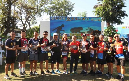 <p><strong>TRIATHLON FOR A CAUSE.</strong> Participants of the Philippine Fleet's "Fun Triathlon" pose for a photo opportunity during the event held at the Naval Base Cavite on Wednesday (Nov. 30, 2022). A total of 200 participants joined the event which aims to raise funds for fallen military personnel<em>. (Photo courtesy of Philippine Fleet)</em></p>