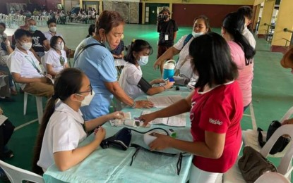 <p><strong>PROTECTION VS. COVID-19</strong>. High school students of St. Joseph School-La Salle in Bacolod City undergo health screening before getting vaccinated against Covid-19 on Nov. 29, 2022. More 12-to-17-year-olds in the city are expected to get booster shots during the Bakunang Bayan: PinasLakas Special Vaccination Days this coming Dec. 5 to 7. <em>(Photo courtesy of Bacolod City Health Office)</em></p>