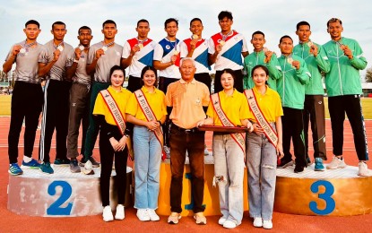 <p><strong>CHAMPION.</strong> The men's 4x400m relay team of (standing on podium 1, from left) Edgardo Alejan Jr., Francis Medina, Michael Carlo del Prado, and Joyme Sequita from the Philippines hold their gold medals during the awarding ceremony of the Thailand Open Track and Field Championships on Thursday (Dec. 1, 2022). Aside from the five gold medals, the Philippines also bagged six silver medals and four bronze medals. <em>(Contributed photo)</em></p>