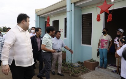 <p><strong>HOUSING PROJECT.</strong> President Ferdinand R. Marcos Jr. inspects a housing unit in Naic, Cavite on Dec. 5, 2022. The Marcos administration has stepped up efforts to address housing woes with the kick-off of its flagship program aimed at constructing over 6 million houses over the course of his tenure, which is expected to benefit some 30 million Filipinos.<em> (File photo)</em></p>