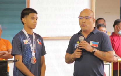 <p><strong>EMERGING ICON.</strong> Seventeen-year-old Ronel Suyom (left) and boxing coach Elmer Pamisa (right) share their experience during Monday's flag ceremony at the Cagayan de Oro City Hall (Dec. 5, 2022). Pamisa said Suyom's silver medal win at the International Boxing Association Youth Men’s and Women’s World Championships in La Nucia, Spain, came in as a surprise in the boxing community. <em>(Photo courtesy of CDO CIO)</em></p>