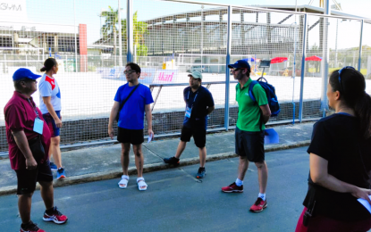 <p><strong>FINAL INSPECTION.</strong> International Volleyball Federation technical delegate Barry "Baz" Wedmaier of Australia (green polo shirt) along with (from left) competition director Adrian Tabanag, tournament director Mayi Molit-Prochina, administrative director Antonio Carlos, venue director Engineer Joseph Remollena and venue manager Cherry Rose Macatangay inspect the Subic Bay Sand Court on Tuesday (Dec. 6, 2022). The Volleyball World Beach Pro Tour Futures will be held from Dec. 8-11 at the same venue inside the Subic Bay Metropolitan Authority (SBMA) in Zambales. <em>(Contributed photo)</em></p>