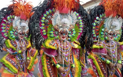 <p><strong>‘BEST FESTIVAL’</strong>. The Masskara dancers of Bacolod City during the highlights of the festival’s 43rd edition in October this year. On Monday night (Dec. 5, 2022), the Masskara Festival was recognized for Best Festival Practices and Performances in the Aliw Awards 2022 held at the Manila Hotel. <em>(PNA Bacolod file photo)</em></p>