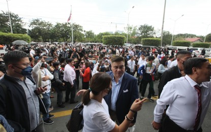 <p><strong>DISRUPTED. </strong> Senate President Juan Miguel Zubiri, other senators, and personnel evacuate the Senate building Wednesday afternoon (December 7, 2022) after a 5.3 quake hit many parts of Luzon. They resumed work after an hour.  <em>(PNA)</em></p>