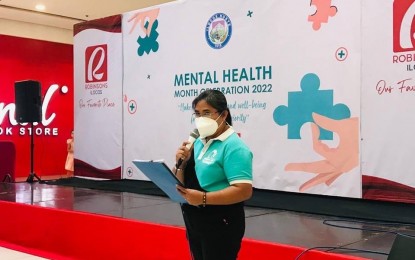 <p><strong>MENTAL HEALTH.</strong> Divine Sevilla, counselor of the "Speak Up, I'm Here" program of the Ilocos Norte government, speaks at a mental health awareness event at Robinsons Ilocos in Ilocos Norte in this undated photo. The Department of Health will recognize Ilocos Norte as the best implementer of mental health programs in the Ilocos Region on Dec. 12, 2022. <em>(Contributed)</em></p>