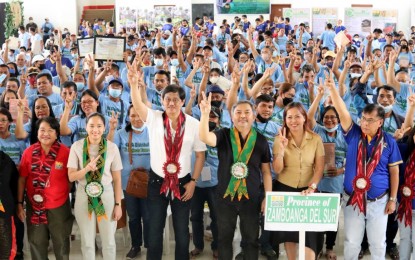 <p><strong>NEW LANDOWNERS</strong> Some 1,582 farmers from the Zamboanga Peninsula receive their land titles from the Department of Agrarian Reform Secretary Conrado Estrella III on Tuesday (Dec. 6, 2022).  During the ceremony, Estrella vowed to bring the government closer to the people.  <em>(Photo courtesy of DAR)</em></p>