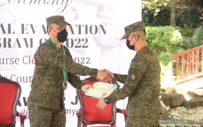 <p><strong>1ST AEROMEDICAL TRAINING</strong>. Headquarters Support Group (HHSG) Commander Brig. Gen. Moises M. Nayve, Jr., hands over the certificate to one of the graduates of the Philippine Army's first-ever aeromedical evacuation training program during the closing ceremony at the Philippine Army Officers’ Clubhouse Pavillion, Fort Bonifacio, Metro Manila on Dec. 5, 2022. The training enhances the student’s knowledge and skills in treating and increasing the survivability of combat-wounded soldiers. (Photo courtesy of PA) </p>
