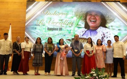 <p> </p>
<p><strong>OUTSTANDING RURAL WOMAN.</strong> Dolores Ceralbo (center), a farmer from Don Salvador Benedicto town, Negros Occidental province, receives her award from Agriculture Undersecretary Domingo Panganiban (5th from right) as the national winner of the 2022 Search for Outstanding Rural Woman. She bested eight other regional winners during the awarding rites held at the PhilRice station in the Science City of Muñoz in Nueva Ecija province on Thursday (Dec. 8, 2022).  (Photo courtesy of the Department of Agriculture)</p>
<p> </p>