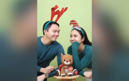 <p><strong>SELF-PORTRAIT BUSINESS</strong>. Young couple, Mark (left) and Kirsten (right) Pangilinan, pose for the camera in their newly opened self-portrait studio in Quezon City in this undated photo. The two said it was perfect timing to set up their business as the economy reopens under a new administration amid the pandemic. <em>(Photo courtesy of Kirsten Pangilinan)</em></p>