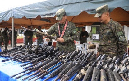 <p><strong>DEMILITARIZED</strong> AFP chief-of-staff Lt.Gen. Bartolome Vicente Bacarro inspects one of the 307 firearms that were "demilitarized" in Maguindanao last December 9. <em>(Photo courtesy of AFP)</em></p>