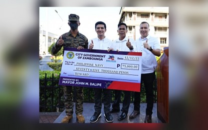 <p><strong>INCENTIVE</strong>. Mayor John Dalipe (2nd from left) presents Monday (Dec. 12, 2022) a PHP75,000 ceremonial check to an official of the Naval Forces Western Mindanao (left) as an incentive for the successful apprehension of some PHP52.8 million worth of smuggled cigarettes on Nov. 25, 2022 off Barangay Labuan, Zamboanga City. The Bureau of Customs – Zamboanga is set to destroy Tuesday some PHP395 million worth of smuggled cigarettes seized in anti-smuggling operations from May to November. <em>(Photo courtesy of Mayor Dalipe’s Facebook page)</em></p>