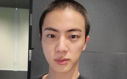 <p>Photo of BTS member Jin with a military haircut captured from Weverse, an online K-pop community platform. <em>(Yonhap)</em></p>