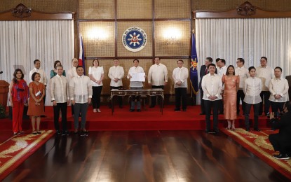 <p><strong>MOVING FORWARD.</strong> President Ferdinand Marcos Jr. (center), surrounded by lawmakers, signs into law the 2023 General Appropriations in Malacañang on Friday (Dec. 16, 2022). In a statement, Finance committee chair Senator Sonny Angara (front, 4th from left) said the PHP5.268 trillion national budget will ensure that assistance is given to those who require it the most and that the momentum is sustained toward economic recovery. <em>(PNA p</em><em>hoto by Alfred Frias)</em></p>