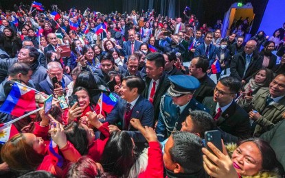 <p><strong>FILIPINO CHRISTMAS</strong>. President Ferdinand R. Marcos receives a warm welcome from the Filipino community in Brussels, Belgium before attending the ASEAN-EU Commemorative Summit on Dec. 14, 2022. In his weekly Vlog on Sunday (Dec. 17), Marcos urged Filipinos to support the government’s effort to provide OFWs with a “Filipino Christmas”.<em> (Photo courtesy of Bongbong Marcos Facebook page)</em></p>