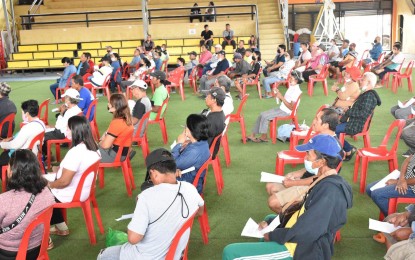 <p><strong>NEW OWNERS.</strong> Forty-seven agrarian reform beneficiaries receive their certificates of land ownership awards at the municipal gym of New Corella in Davao del Norte on Dec. 5, 2022. The Department of Agrarian Reform plans to issue about 134,000 more individual titles in 2023. <em>(Courtesy of DAR-Davao del Norte)</em></p>