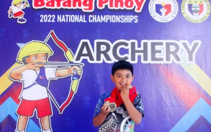 <p><strong>YOUNG ARCHER.</strong> Jathniel Caleb Fernandez of Baguio City bagged five gold medals in the archery competition of the Philippine Sports Commission-Batang Pinoy National Championships at the San Ildefonso Central School on Dec. 19, 2022. Adrianna Jessie Magbojos of Sta. Rosa City, Laguna also won five golds in archery.<em> (Photo courtesy of PSC)</em></p>