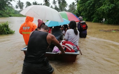 <p><strong>OFF TO SAFETY</strong>. Families are shown being rescued and evacuated in Barangay Santa Maria, Lagonoy town in Camarines Sur province due to flooding. As of 9:30 a.m. Thursday (Dec. 22, 2022), Gremil Alexis Naz, Office of Civil Defense-Bicol spokesperson, said a total of 1,555 families or 6,118 persons are still displaced in the provinces of Camarines Norte and Camarines Sur due to the heavy rains brought by the northeast monsoon and shear line. <em>(Photo from Edmero Camarines Sur's Facebook account)</em></p>