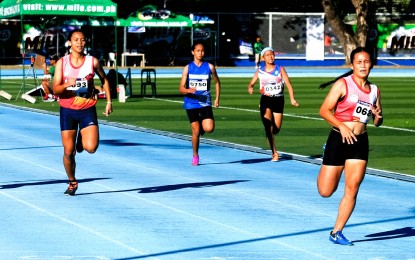 <p><strong>TRIPLE-GOLD MEDALIST</strong>. Leonelyn Compuesto of Masbate (far right) competes in the girls' 400-meter dash in the PSC-Batang Pinoy National Championships at the Quirino Stadium in Bantay, Ilocos Sur on Tuesday (Dec. 20, 2022). She won the race for her third gold medal. <em>(Photo courtesy of PSC)</em></p>