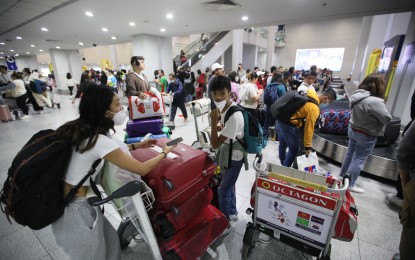 <p><strong>PARTNERS IN RECOVERY.</strong> Returning Filipinos and foreign tourists arrive at the Ninoy Aquino International Airport Terminal 3 on Dec. 20, 2022. At the 26th ASEAN Tourism Ministers meeting in Indonesia on Saturday (Feb. 4, 2023), Tourism Secretary Christina Frasco said access to airports would leave a lasting impression on tourists.<em> (PNA photo by Avito Dalan)</em></p>