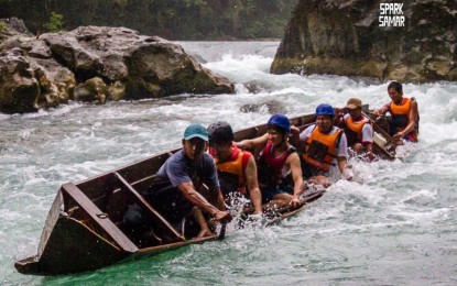 <p><strong>EXTREME.</strong> The boat ride experience at Ulot River in Paranas, Samar. Boatmen managing the site get new engines to sustain their tourism activity. <em>(Photo courtesy of Spark Samar)</em></p>