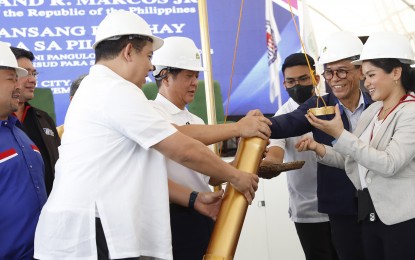 <p><strong>INFRASTRUCTURE PROGRAM.</strong> President Ferdinand R. Marcos Jr. leads the groundbreaking of Pambansang Pabahay Para sa Pilipino Program at the Palayan City Township Housing Project in Nueva Ecija on Dec. 21, 2022. The government's infrastructure program is expected to boost sales of cement manufacturing companies in the country. <em>(PNA file photo)</em></p>
