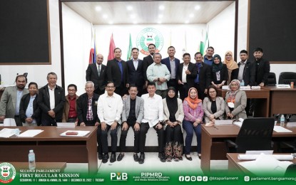 <p><strong>BUDGET APPROVED.</strong> The Bangsamoro Transition Authority (BTA) approves Tuesday (Dec. 20, 2022) the 2023 P85.3 billion Bangsamoro Expenditure Program with priority given to education, health, infrastructure and social services. Some members of the BTA pose for posterity photo after the approval of the budget, which is higher by PHP5.5 billion than the previous year. <em>(BTA photo)</em></p>