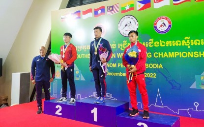 <p><strong>WINNER </strong>Gold medalist Alvin Lobreguito from the Philippines (center) on the podium with bronze medalist Zainal Abidin of Indonesia (left) and silver medalist Khac Huy Phung of Vietnam during the awarding ceremony of the men's freestyle 57kg category at the Southeast Asian Championships in Phnom Penh, Cambodia on December 18, 2022. <em>(Photo courtesy of United World Wrestling)</em></p>