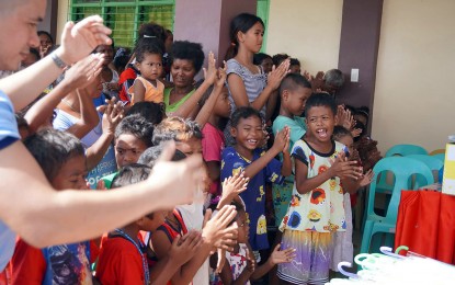 <p><strong>EARLY CHRISTMAS.</strong> Happiness is written all over the faces of children during a gift-giving activity for 145 families of the Mamanwa tribe in Barangay Cantugas, Mainit, Surigao del Norte province on Friday (Dec. 23, 2022). The outreach program was initiated by the Police Regional Office in the Caraga Region and its various partners. <em>(Courtesy of SDNPPO)</em></p>
