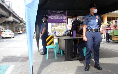 <p><strong>SECURING THE HOLIDAYS. </strong>Quezon City Police District officers stand guard on the side of the road near the Kamias bus terminal along EDSA, Quezon City on Dec 24, 2022. Under the Oplan Ligtas Paskuhan 2022, the Philippine National Police aims to increase police presence to ensure public safety during the Yuletide celebrations. <em>(PNA photo by Robert Oswald P. Alfiler)</em></p>