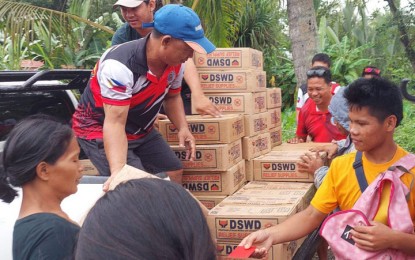 <p><strong>FOOD PACKS</strong>. The Department of Social Welfare and Development in Region 9 (DSWD-9) distributes on Monday (Dec. 26, 2022) family food packs to residents affected by continuous rains caused by the shear line in three Zamboanga del Norte towns. The DSWD-9 also distributed modular tents to the municipal government of Roxas, Zamboanga del Norte for the use of the affected families staying in evacuation center. <em>(Photo courtesy of DSWD-9) </em></p>