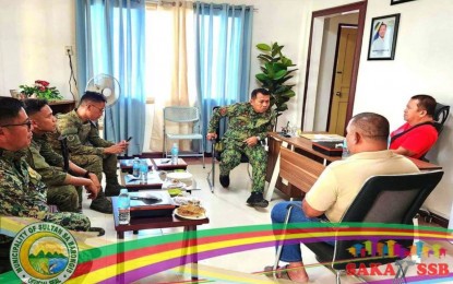 <p><strong>ADDRESSING THE PROBLEM.</strong> Mayor Allandatu Angas Sr. (in red right) of Sultan sa Barongis, Maguindanao del Sur, meets with police and military officials on Wednesday (Dec. 28, 2022) to find a solution to help end hostilities in Barangay Barurao involving MILF members. Clashes between two MILF groups in the area erupted on Tuesday and killed three Moro combatants. <em>(Photo courtesy of Sultan sa Barongis MIO)</em></p>