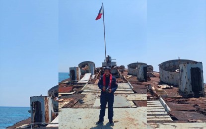 <p><strong>THANKS TO 4Ps.</strong> Nicolas Sanico, 25, a member of the Philippine Coast Guard, poses in a station where he was assigned in Palawan, in this undated photo. Sanico, the coastguardsman who documented the May 2021 incident involving a PCG vessel warning a Chinese ship entering the Philippine exclusive economic zone in Sabina Shoal over the West Philippine Sea, recalled how the Pantawid Pamilyang Pilipino Program and the Expanded Student’s Grants-in-Aid Program for Poverty Alleviation helped him and his brother got college education. <em>(Photo courtesy of Sanico family through DSWD-7) </em></p>