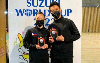 <p><strong>BRONZE MEDALISTS.</strong> Filipino aerobic gymnasts Charmaine Dolar and Carl Joshua Tangonan show their mixed pair bronze medals during the awarding ceremony of the Suzuki World Cup in Tokyo, Japan on Dec. 14, 2022. Both will compete at the 2023 Cambodia SEA Games but only in individual events. <em>(Contributed photo) </em></p>