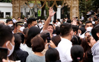 <p><strong>APPRECIATION</strong>. President Ferdinand R. Marcos Jr. waves to families of overseas Filipino workers during the “Pamaskong Handog Para sa Pamilyang OFW” at the Kalayaan grounds of Malacañang Palace in Manila on Dec. 30, 2022. On Monday (April 1, 2024), Duty Free Philippines (DFP) announced a 5-percent discount for OFWs and balikbayans at its flagship store in Parañaque City. <em>(PNA photo by Rey S. Baniquet)</em></p>