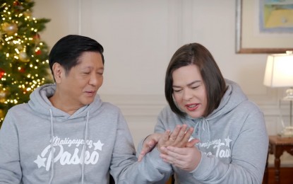 <p>President Ferdinand R. Marcos Jr. and Vice President Sara Duterte answer questions from netizens and try to read each other's palms in Marcos' recent volg.<em> (Screengrab from BBM vlog) </em></p>