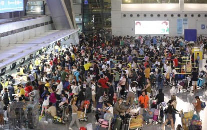 <p><strong>GLITCH </strong>The Bureau of Immigration says Monday (Jan. 2, 2023) it will deploy more personnel as it expects an influx of passengers in the coming days.  Thousands of passengers were stranded at NAIA terminal 3 on New Year's Day due to a technical glitch. <em>(PNA photo by Avito Dalan)</em></p>