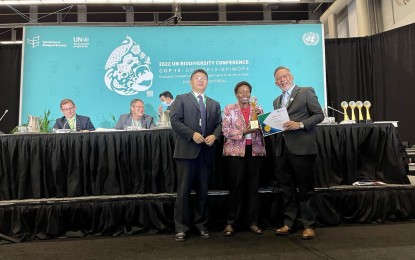 <p><strong>GOLD AWARD.</strong> (From left) Liu Ning, representative of the Chinese COP 15 Presidency; Elizabeth Mrema, Executive Secretary of the Convention on Biological Diversity Secretariat; and Ernesto Adobo Jr., Undersecretary for Administration, Finance, Human Resources, Information Systems, Legal, Legislative Affairs, and Anti-Corruption of the Department of Environment and Natural Resources, Philippines during the awarding in Canada. The Philippines has won the gold award for making the "most significant progress" in developing its existing national Clearing-House Mechanism website, making biodiversity information accessible in the country. <em>(Photo courtesy of ASEAN Centre for Biodiversity)</em></p>