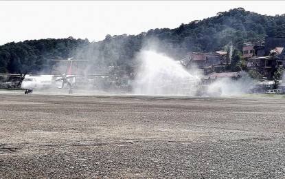 <p><strong>FLIGHT-READY.</strong> A Philippine Airlines plane is sprayed with water upon its arrival at the Loakan airport in Baguio City during the resumption of commercial flights on Dec. 16, 2022. Residents residing near the runway area will soon be prohibited by the Civil Aviation Authority of the Philippines as a security and safety measure with the resumption of commercial flights. <em>(PNA photo by Liza T. Agoot)</em></p>