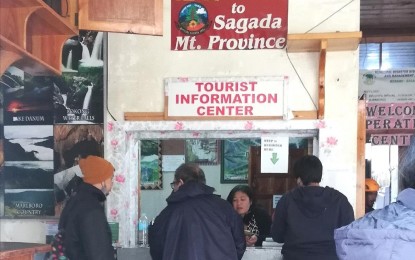 <p><strong>BOOMING TOURISM.</strong> Tourists register at the tourist information office in Poblacion Sagada in time for the All Saints’ day commemoration in 2022 to witness the “panag-apoy” (lighting) that makes the town look like it is on fire. Mayor Felicito Dula said the town is celebrating the Etag festival in the first week of February as an add-on feature to attract more tourists with the town’s economy relying on tourism. <em>(PNA photo by Liza T. Agoot)</em></p>