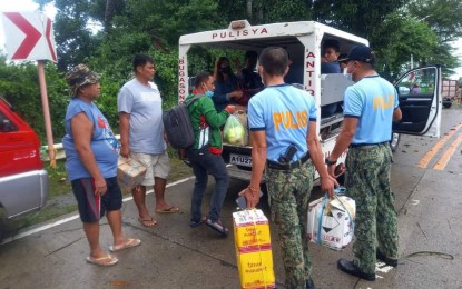 <p><strong>ASSISTANCE</strong>. Police Personnel in the Municipality of Bugasong assist stranded individuals during the onslaught of Severe Tropical Storm Paeng on Oct. 29, 2022. Antique Provincial Police Office Information Officer Lt. Col. Joseph Puno said on Thursday (Jan. 5, 2023) the PHP48. 2 million budget for their equipment and other needed resources would help beef up their disaster response capabilities. <em>(Photo courtesy of Antique Provincial Police Office)</em></p>
